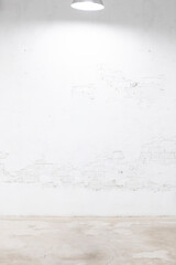 concrete wall and floor with an overhead light