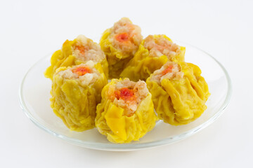 Close up of Chinese steamed dumpling 6 piece on plate, white background.