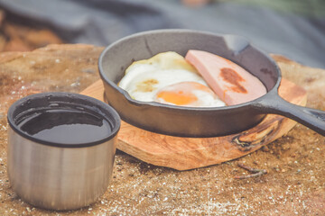 a hot tea and scrambled eggs are served for Breakfast at the campsite