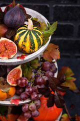 Halloween composition with autumn fruits