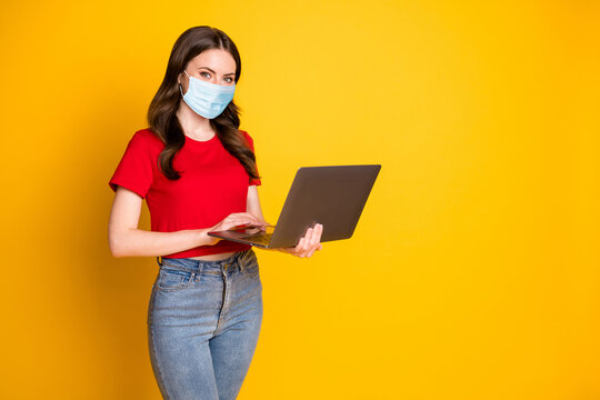 Photo of positive girl work laptop enjoy networking coworking wear mask isolated over bright shine color background