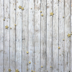 Christmas confetti on wooden background