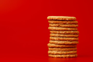 Stack of round oat cookies on paper background