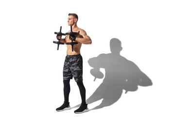 Activity, strong body. Stylish young male athlete on white studio background, portrait with shadows. Sportive fit model in motion and action. Body building, healthy lifestyle, style concept.