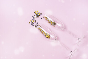 Confetti in the Shape of Stars Poured out Glasses of Champagne on the Pink Background Top View Copy Space Holiday and Festive Concept Drawing Snow