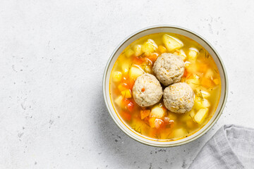 Healthy turkey meatball soup. Top view, space for text.