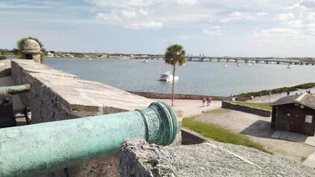 Historic cannon overlooking bay from fortress in St. Augustine, Florida