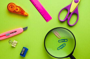 a set of school supplies lie in a circle with a free center