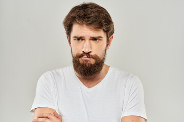 Bearded man gesturing with hand white cropped t-shirt studio lifestyle