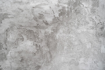 Texture of gray plaster on a white wall. Abstract background or empty blank.