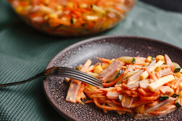 Korean carrot salad with ham, cucumber and corn. Top view, side view.