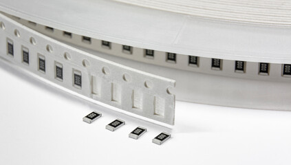 Close-up of tape with surface mount electronics components - resistors