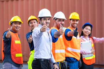 Success Team of foreman and worker people showing thumbs up sign in workplace. container yard port of import and export. Business teamwork concept
