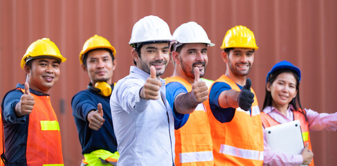 Success Team of foreman and worker people showing thumbs up sign in workplace. container yard port of import and export. Business teamwork concept