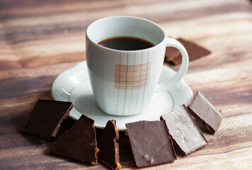 
Black coffee standing on the table with chocolate