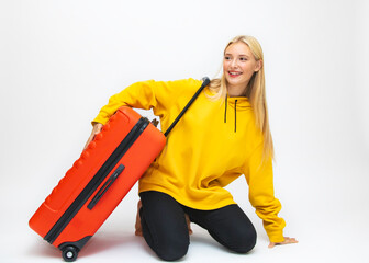 Girl student beautiful suitcases travel to rest close-up happiness joy