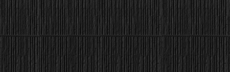 Panorama of Modern black stone wall with stripes texture and seamless background
