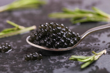 Black sturgeon caviar in a spoon