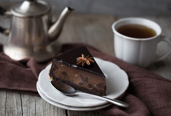 slice of Chocolate  Cake on dark background. Classic chocolate cake with dark chocolate 