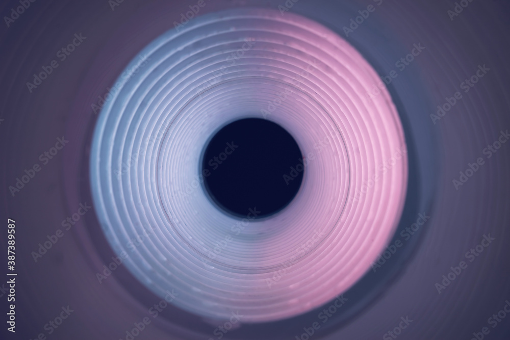 Poster beautiful round abstract pink tunnel with color light on a background pattern textured ford design.