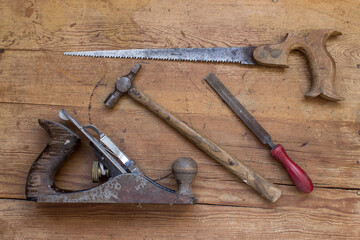 Old tools on wooden surface