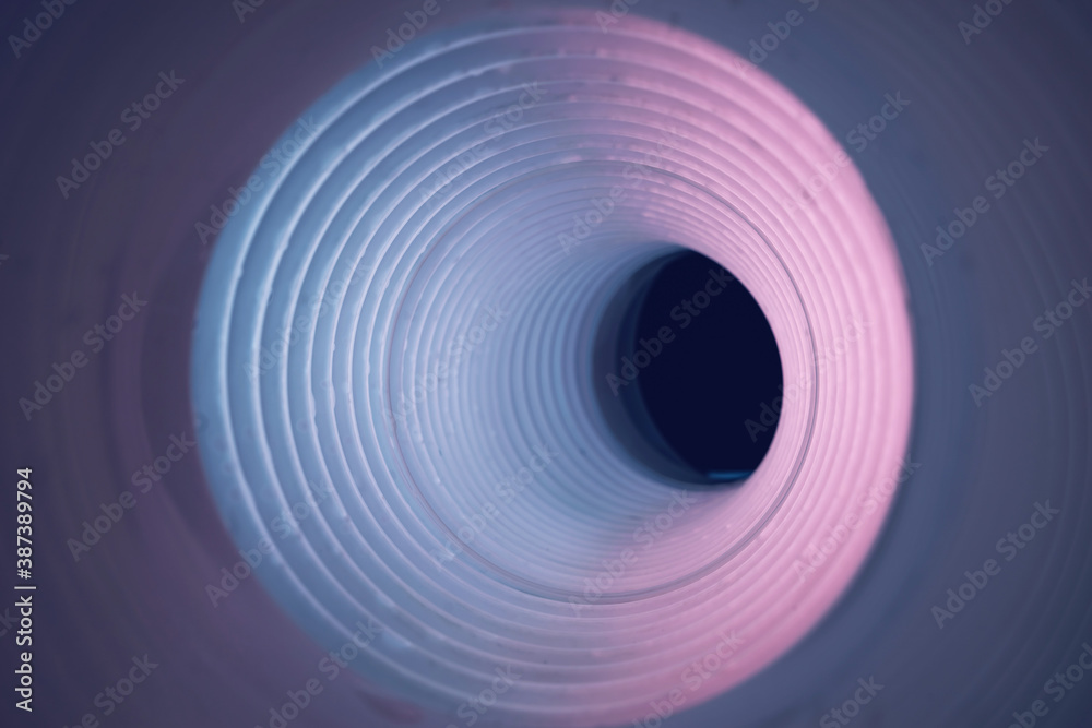 Poster beautiful round abstract pink tunnel with color light on a background pattern textured ford design.
