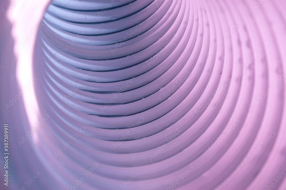 Poster beautiful round abstract white-gray tunnel with color light on a background pattern textured ford de