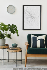 Modern retro concept of home interior with design green sofa, coffee tables, plants, mock up poster map, carpet and personal accessoreis. Stylish home decor of living room.