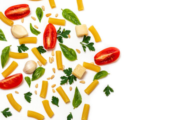 pasta, greens, pine nuts, slices of tomato, cheese and garlic on a white background. space for text on the right