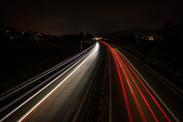 Fototapeta na wymiar Motorway in night with red and white car light trails