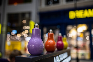 glasses for juices in the form of multi-colored lamps on the counter