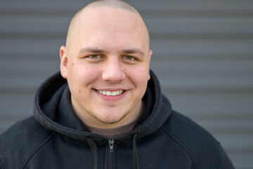 Attractive modern young man with shaved head