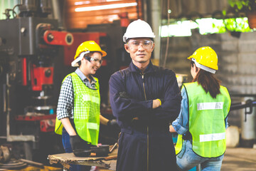 Man Worker at industrial factory wearing uniform and hardhats. Engineering and architecture concept