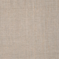 Textured background of rough light fabric.