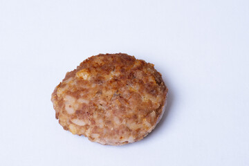 Cooked meat cutlet on a white plate, close-up, copy space, top view. Protein food concept, healthy food, diet