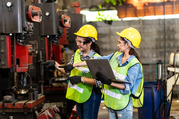 Manufacturing Factory female Mechanical Engineer Works on Personal Computer at industrial factory