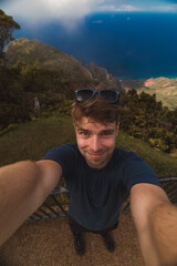 self portrait at Pu'u O Kila Lookout ridge mountains and Pacific ocean at the kauai island of hawaii archipelago