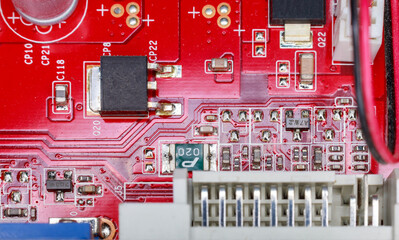 Computer Chips On The red Circuit Board. Close-Up. Technological Progress Concept