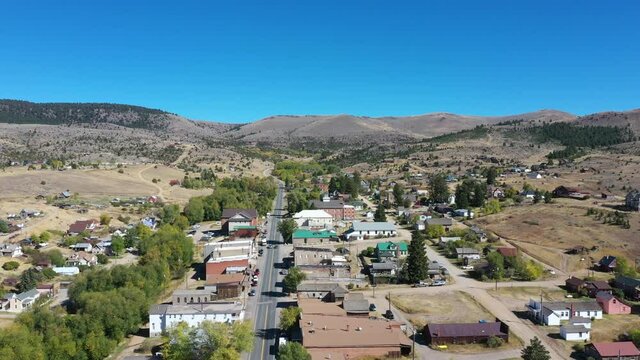 Aerial Virginia City Montana historic mining town 4K. Restored wild west mining town. Restored wild west mining town. Gold mine rush now an historic site and tourism center. Restoration businesses.