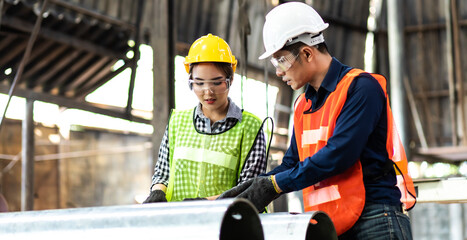 Professional operators team Engineer woman and Man Worker at industrial factory wearing uniform and...