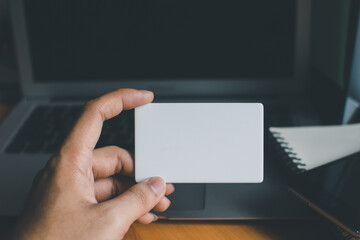 Business people hold credit cards and use computers Online shopping Office concept..