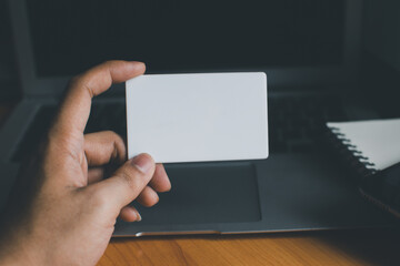 Naklejka premium Business people hold credit cards and use computers Online shopping Office concept..