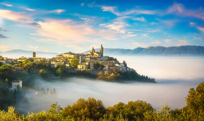 Trevi picturesque village in a foggy morning. Perugia, Umbria, Italy.