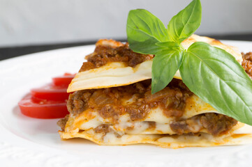 Meat lasagna with basil.