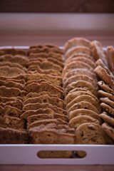 vertical image tray of sweet breads and baked treats. Banana bread and chocolate chip cookies for a large gathering. 