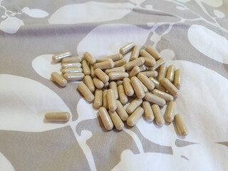 Brown oval pills on the bed Iron dietary supplement