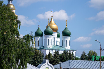 Kolomna, Russia - July 7, 2020: Domes of the Cathedral of the Holy Trinity Novo-Golutvin Monastery on a sunny day