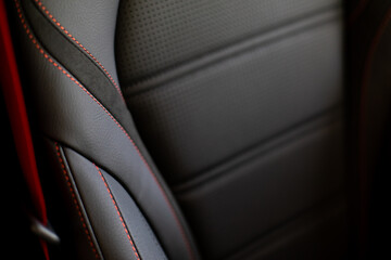 Close up and interior details of modern luxury sport cars. Comfortable leather cockpit seats inside...