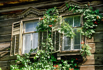 Windows of an old Russian wooden house from the times of the Russian Empire with elements of carved decorations.
Astrakhan, Russia.