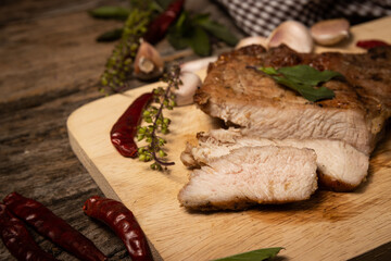 Roast pork on a cutting board.